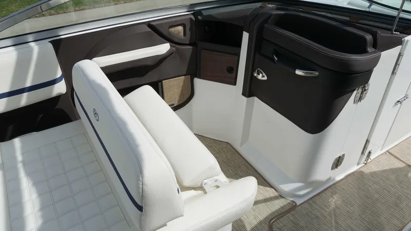 Slide: The Image of 2019 Cobalt R7 boat interior with white seating and sleek design. - 13