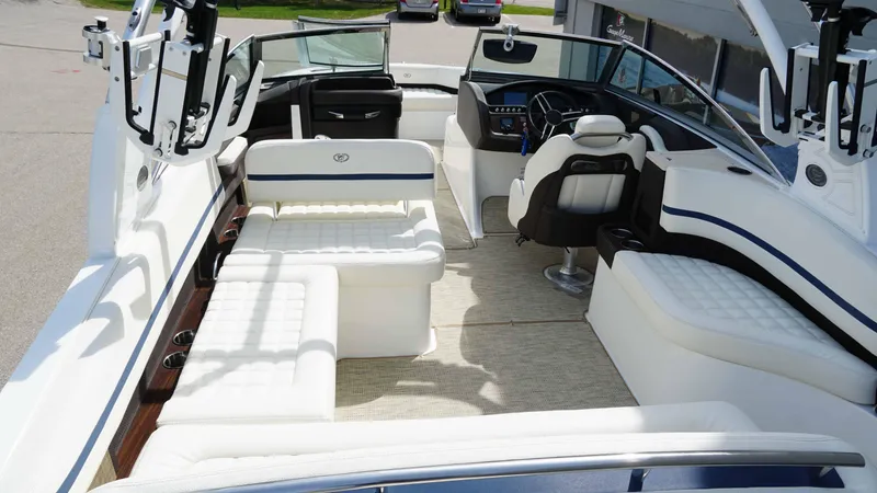 Slide: The Image of 2019 Cobalt R7 boat interior with white seating and modern dashboard. - 6