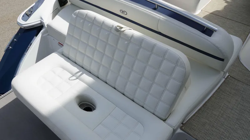Slide: The Image of 2019 Cobalt R7 boat with white cushioned seating and integrated cup holder. - 8