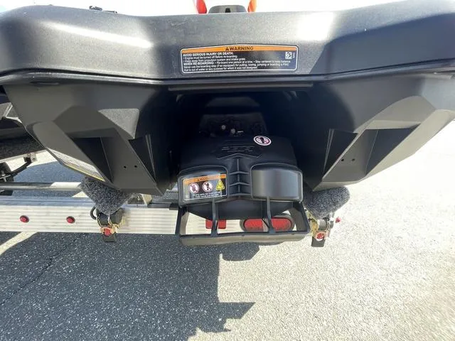 Slide: The Image of Rear view of 2025 Sea-Doo Waverunner Spark Trixx on trailer, showcasing engine details. - 6