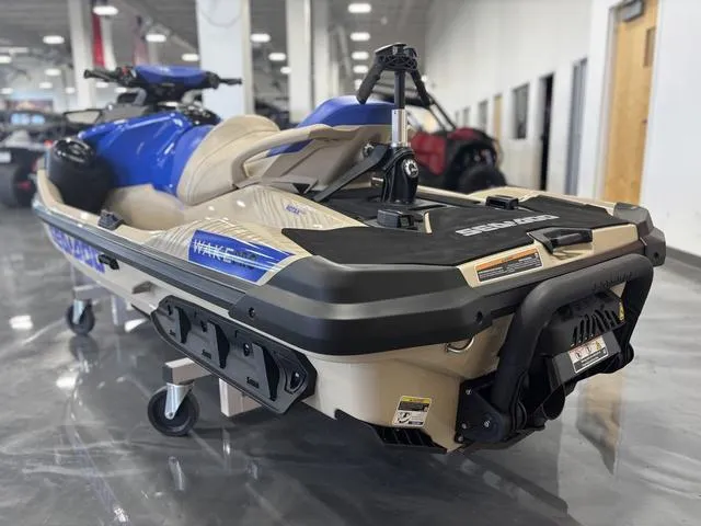 Slide: The Image of 2025 Sea-Doo Waverunner Wake in showroom, featuring sleek design and blue accents. - 4