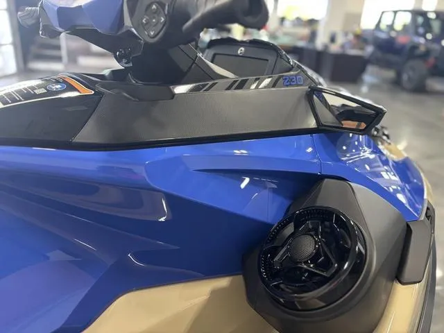 Slide: The Image of 2025 Sea-Doo Waverunner Wake handlebars, featuring blue accents and control buttons. - 8