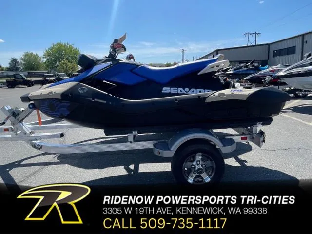 Slide: The Image of 2025 Sea-Doo Spark Trixx Waverunner, blue and black design, Rotax 900 ACE engine. - 1