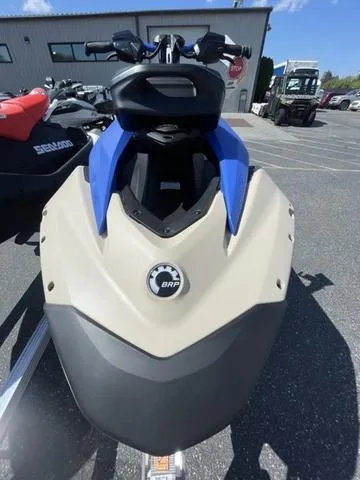 Slide: The Image of 2025 Sea-Doo Waverunner Spark Trixx, beige and blue, parked outdoors. - 11
