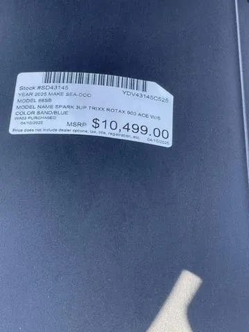 Slide: The Image of 2025 Sea-Doo Spark Trixx price tag, MSRP $10,499, sand blue color. - 13