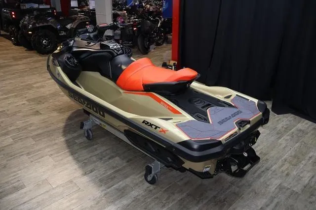 Slide: The Image of 2025 Sea-Doo Waverunner RXT-X with sleek black design and geometric patterns. - 10