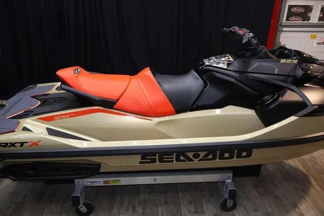 Slide: The Image of 2025 Sea-Doo Waverunner RXT-X close-up, showcasing sleek design and mirror reflection. - 13