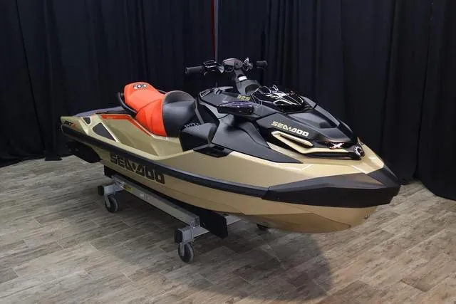 Slide: The Image of 2025 Sea-Doo RXT-X Waverunner in showroom, featuring sleek design and vibrant colors. - 16