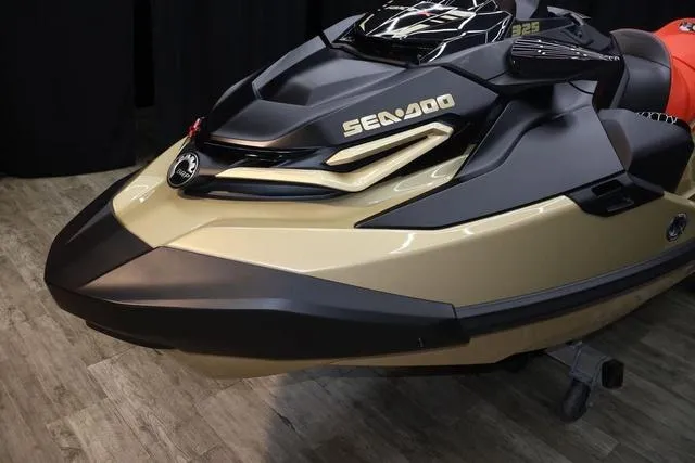 Slide: The Image of 2025 Sea-Doo Waverunner RXT-X, gold and black, front view on display. - 6