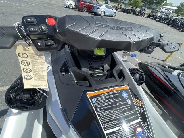Slide: The Image of 2025 Sea-Doo Waverunner GTX dashboard with controls and safety instructions in a parking lot. - 11
