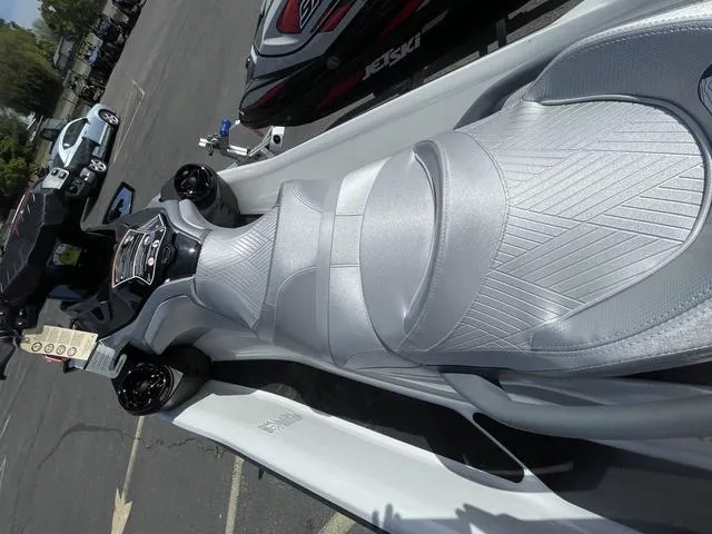 Slide: The Image of 2025 Sea-Doo Waverunner GTX with sleek silver seating, parked outdoors. - 9