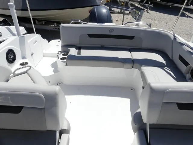 Slide: The Image of 2023 Hurricane SunDeck 235 OB boat interior with spacious seating and cup holders. - 12