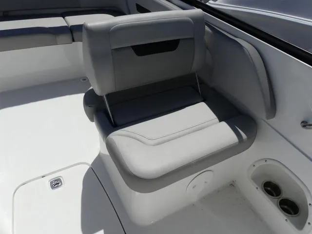 Slide: The Image of 2023 Hurricane SunDeck 235 OB boat interior seating, featuring sleek gray upholstery and modern design. - 13