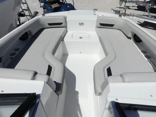 Slide: The Image of 2023 Hurricane SunDeck 235 OB boat interior with spacious seating and modern design. - 15