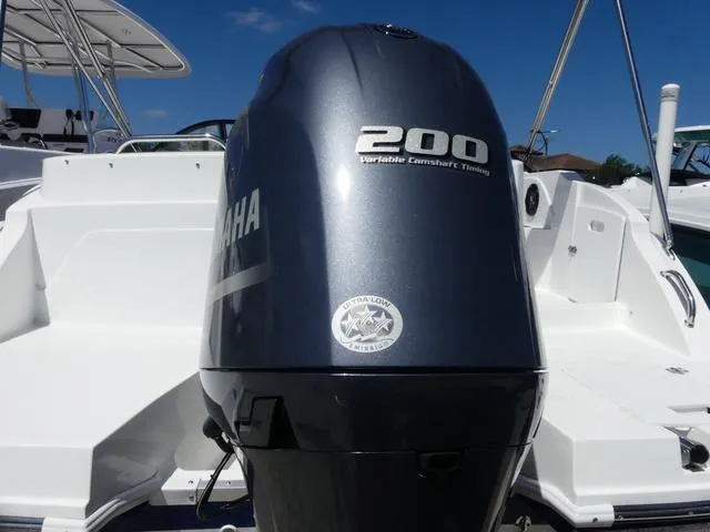 Slide: The Image of 2023 Hurricane SunDeck 235 OB with Yamaha 200 outboard motor, showcasing sleek design and power. - 5