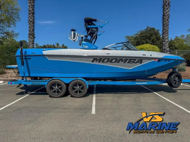 Slide: The Image of 2022 Moomba Makai boat in blue on a trailer at VS Marine Boating Center. - 1