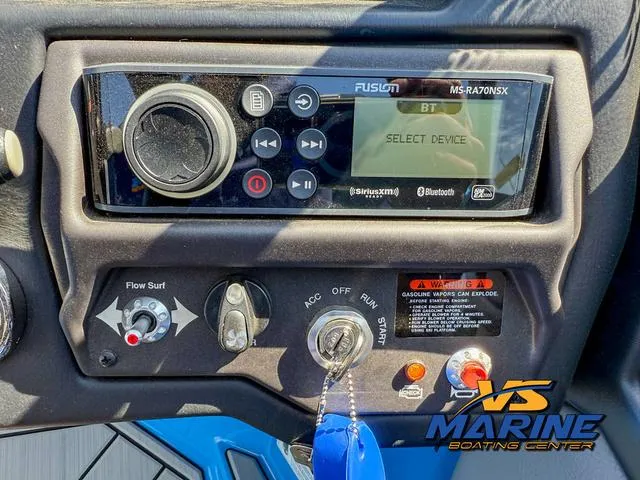 Slide: The Image of Control panel of 2022 Moomba Makai boat with Fusion stereo system and ignition switch. - 21
