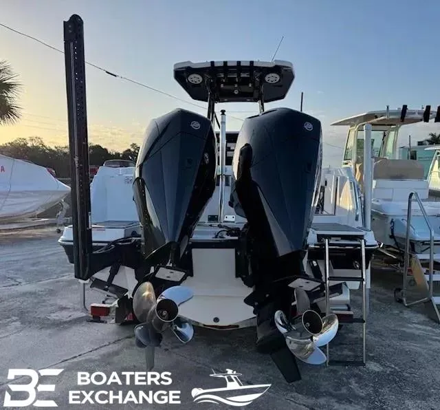 Slide: The Image of 2020 Blackfin 242CC boat with dual outboard engines at Boaters Exchange. - 2