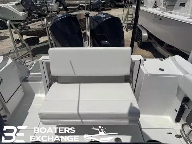 Slide: The Image of 2020 Blackfin 242CC boat with dual engines and white seating at Boaters Exchange. - 4