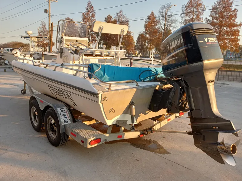 Slide: The Image of 2000 Champion 21 Bay Champ boat with Yamaha V250 outboard motor on trailer. - 3