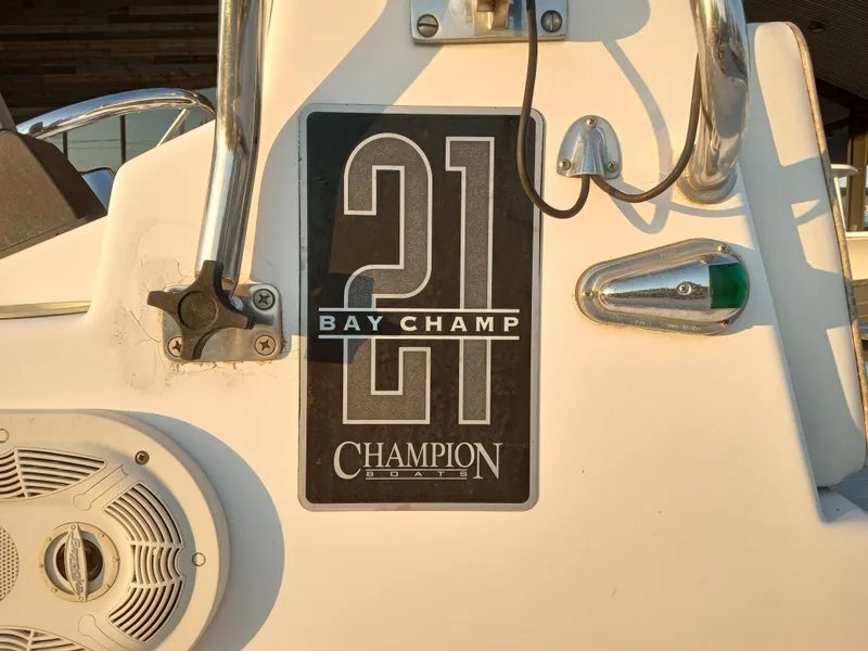Slide: The Image of Champion 21 Bay Champ 2000 boat logo with speaker and navigation light. - 5