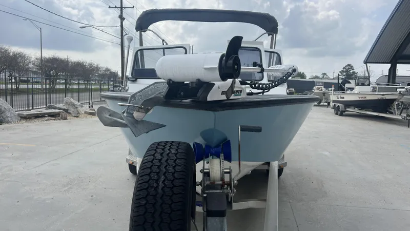 Slide: The Image of 2000 Gravois 22' Dual Console Hybrid boat on trailer, parked outdoors. - 15