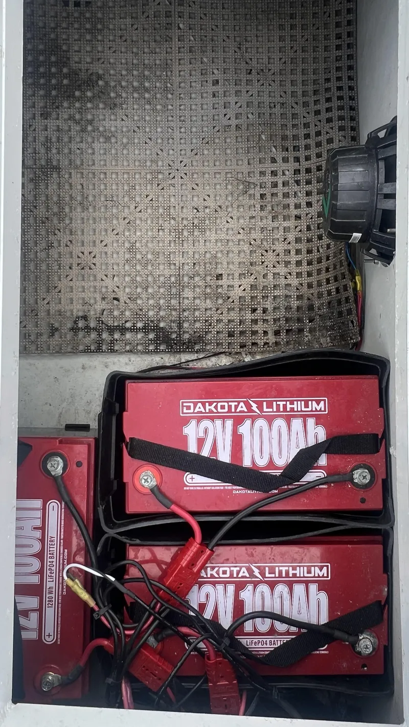 Slide: The Image of Lithium batteries in a 2000 Gravois 22' Dual Console Hybrid boat compartment. - 19