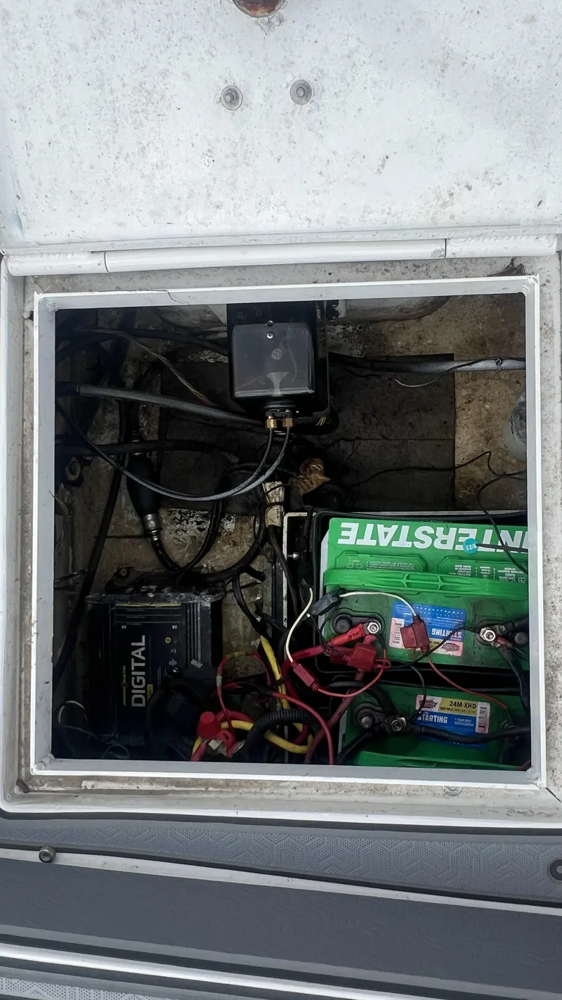 Slide: The Image of Battery compartment of a 2000 Gravois 22' Dual Console Hybrid boat. - 22