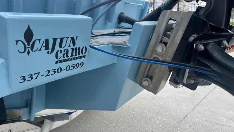 Slide: The Image of Gravois 22' Dual Console Hybrid 2000 with Cajun Camo Painting details and contact number. - 23