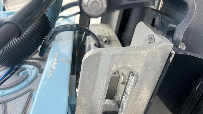 Slide: The Image of Close-up of a Gravois 22' Dual Console Hybrid boat component, showcasing metal and wiring details. - 4