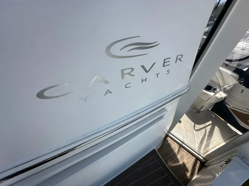 Slide: The Image of 2007 Carver 43 Motor Yacht entrance with logo, showcasing luxury design details. - 11