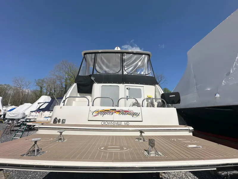 Slide: The Image of 2007 Carver 43 Motor Yacht docked in Crownsville, MD under clear blue sky. - 15