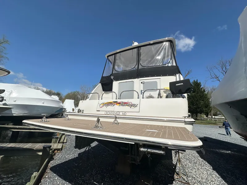 Slide: The Image of 2007 Carver 43 Motor Yacht on display, featuring spacious deck and sleek design. - 17