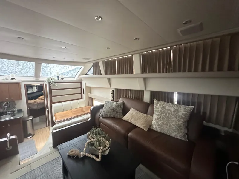 Slide: The Image of Interior of 2007 Carver 43 Motor Yacht with cozy seating and elegant decor. - 26