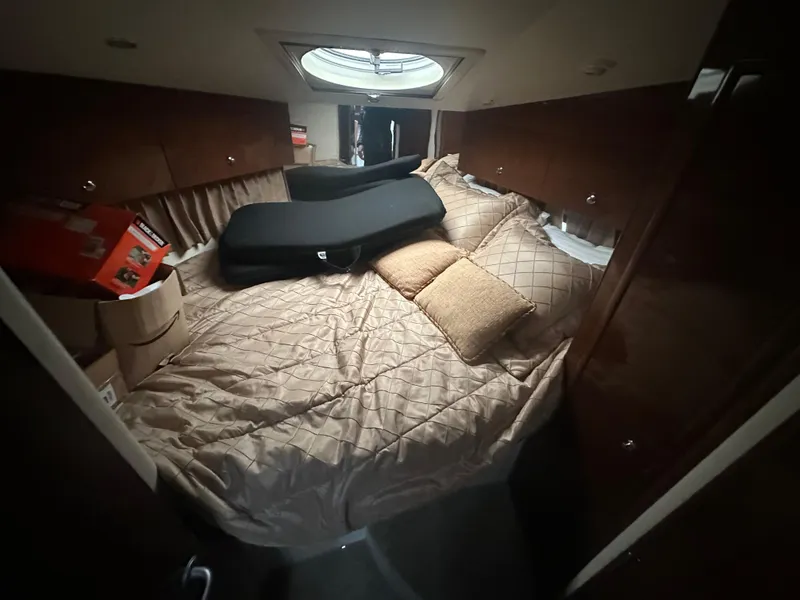 Slide: The Image of Cozy bedroom in 2007 Carver 43 Motor Yacht with plush bedding and storage. - 29