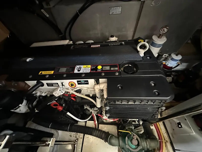 Slide: The Image of Engine compartment of a 2007 Carver 43 Motor Yacht, featuring a Volvo Penta engine. - 46