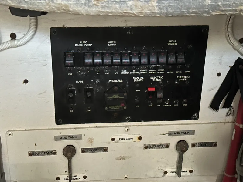 Slide: The Image of Control panel of a 2007 Carver 43 Motor Yacht, featuring switches and valves. - 48
