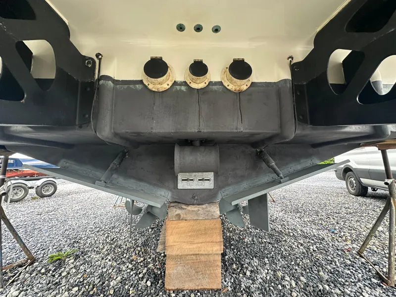 Slide: The Image of 2007 Carver 43 Motor Yacht underside view with exhaust ports and propeller. - 58