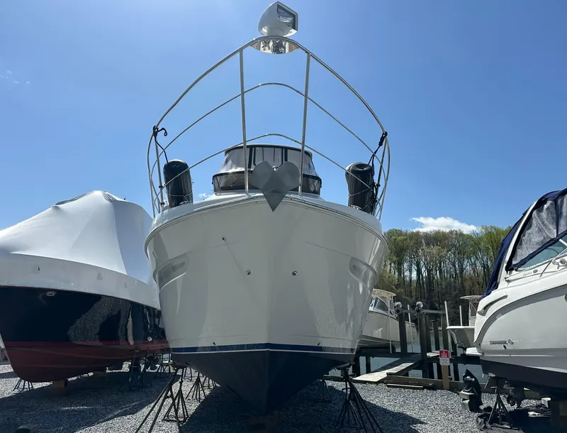 Slide: The Image of 2007 Carver 43 Motor Yacht on dry dock under clear blue sky. - 6