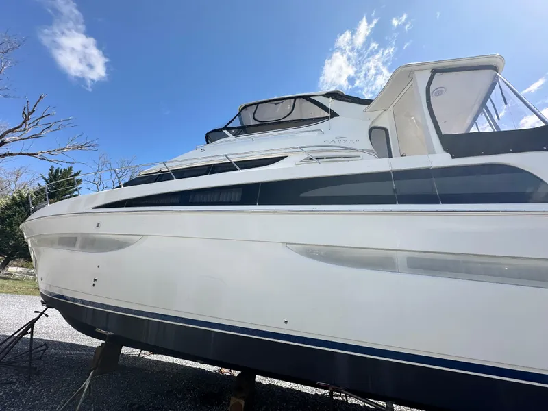 Slide: The Image of 2007 Carver 43 Motor Yacht on stands under a clear blue sky. - 7