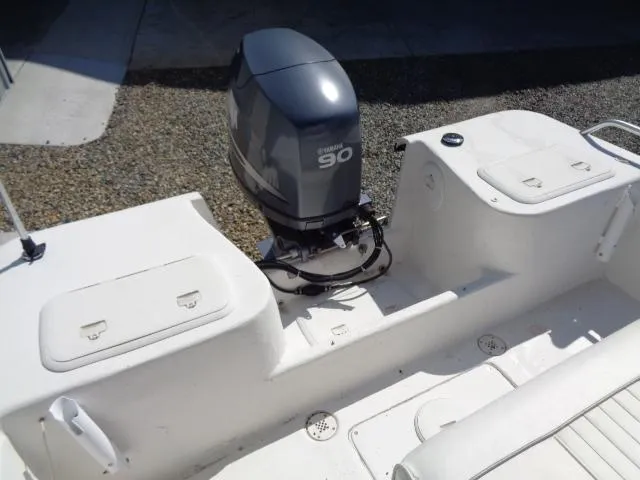 Slide: The Image of 2005 Sea Chaser 1800 RG boat with a 90 HP outboard motor, white interior. - 12