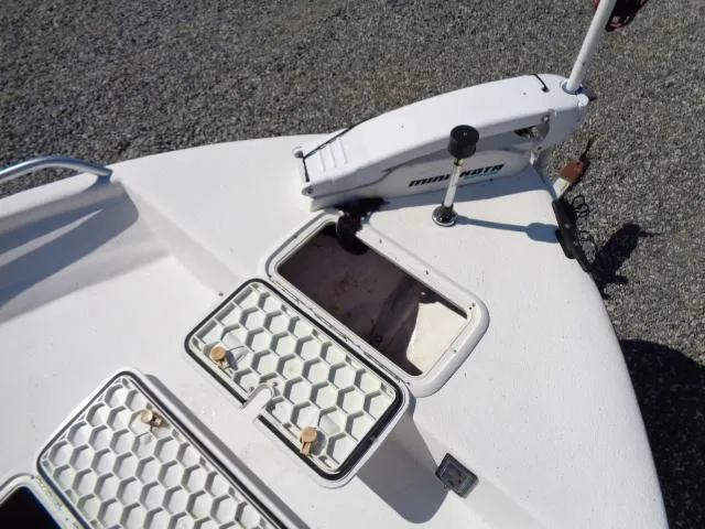 Slide: The Image of 2005 Sea Chaser 1800 RG boat deck with storage compartments and trolling motor. - 14