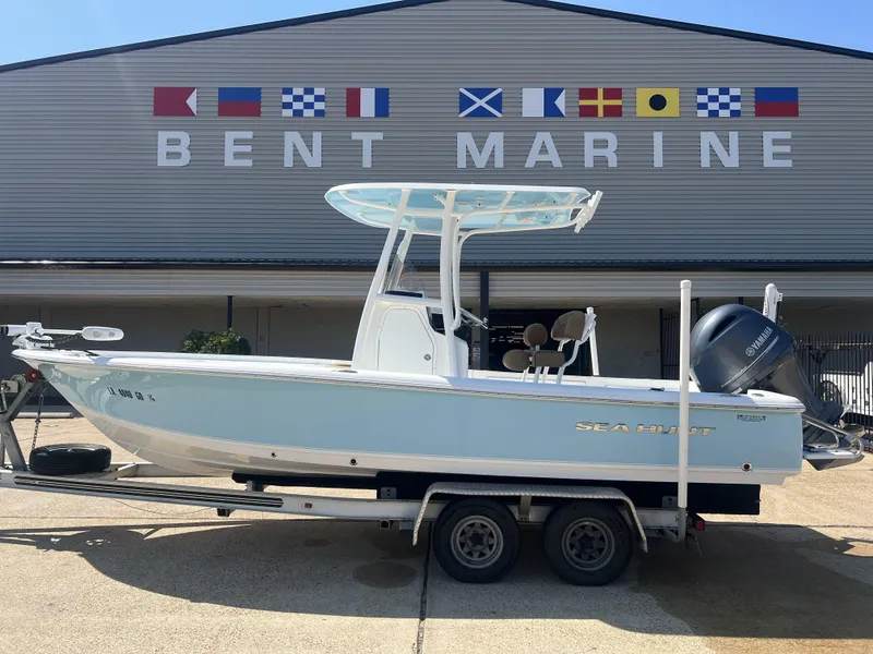 Slide: The Image of 2015 Sea Hunt BX 22 BR boat on trailer at Bent Marine dealership. - 1