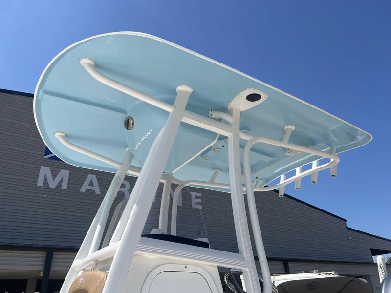 Slide: The Image of 2015 Sea Hunt BX 22 BR boat T-top against clear blue sky. - 3