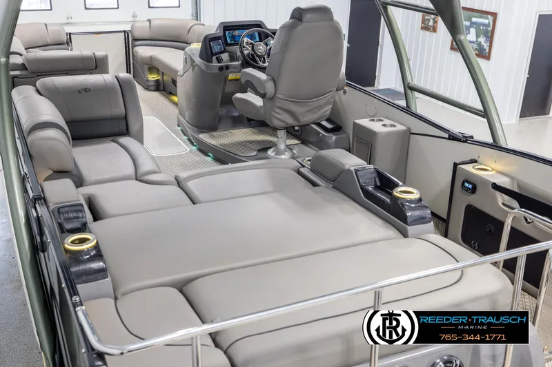 Slide: The Image of 2022 Avalon Catalina VRB pontoon boat interior with luxurious seating and modern dashboard. - 10