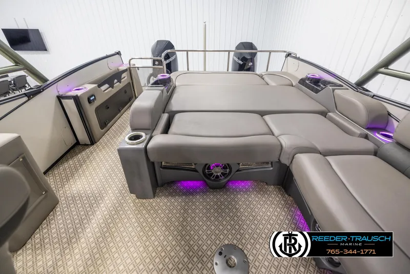 Slide: The Image of 2022 Avalon Catalina VRB pontoon boat interior with luxurious seating and ambient lighting. - 14