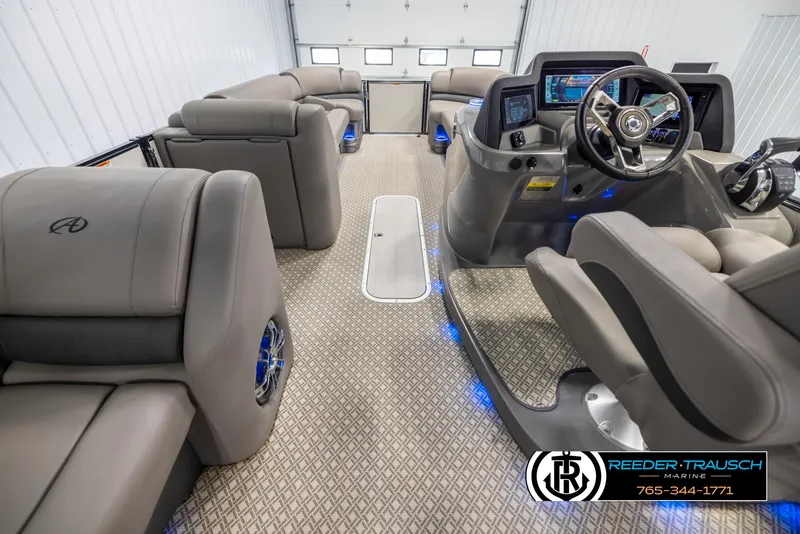 Slide: The Image of 2022 Avalon Catalina VRB boat interior with luxurious seating and modern dashboard. - 16