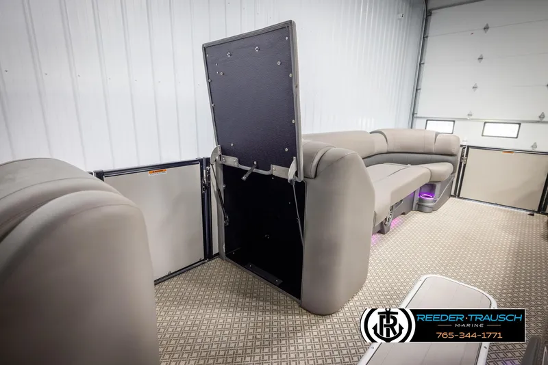 Slide: The Image of 2022 Avalon Catalina VRB pontoon interior with plush seating and storage compartment. - 20