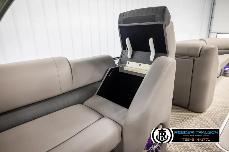 Slide: The Image of 2022 Avalon Catalina VRB boat interior with open storage compartment and plush seating. - 22