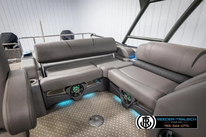 Slide: The Image of 2022 Avalon Catalina VRB boat interior with gray seating and ambient lighting. - 24